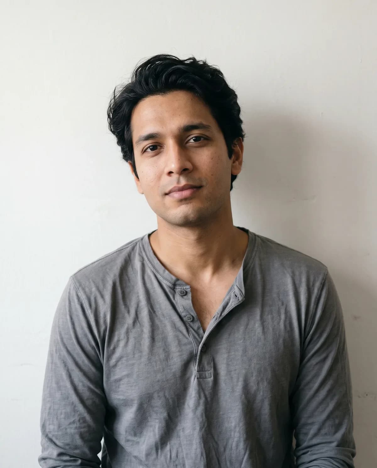 Casual portrait before a black velvet sherwani AI edit.